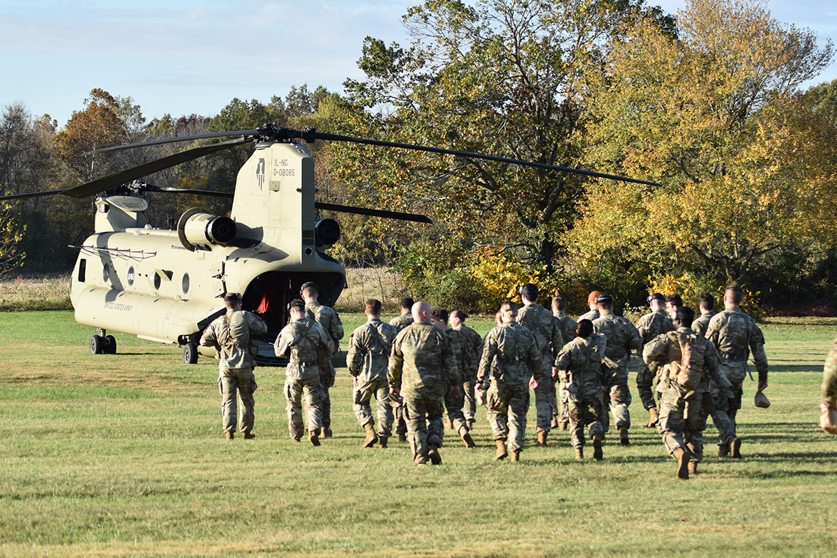 SIU Army ROTC cadets head toward an Army helicopter