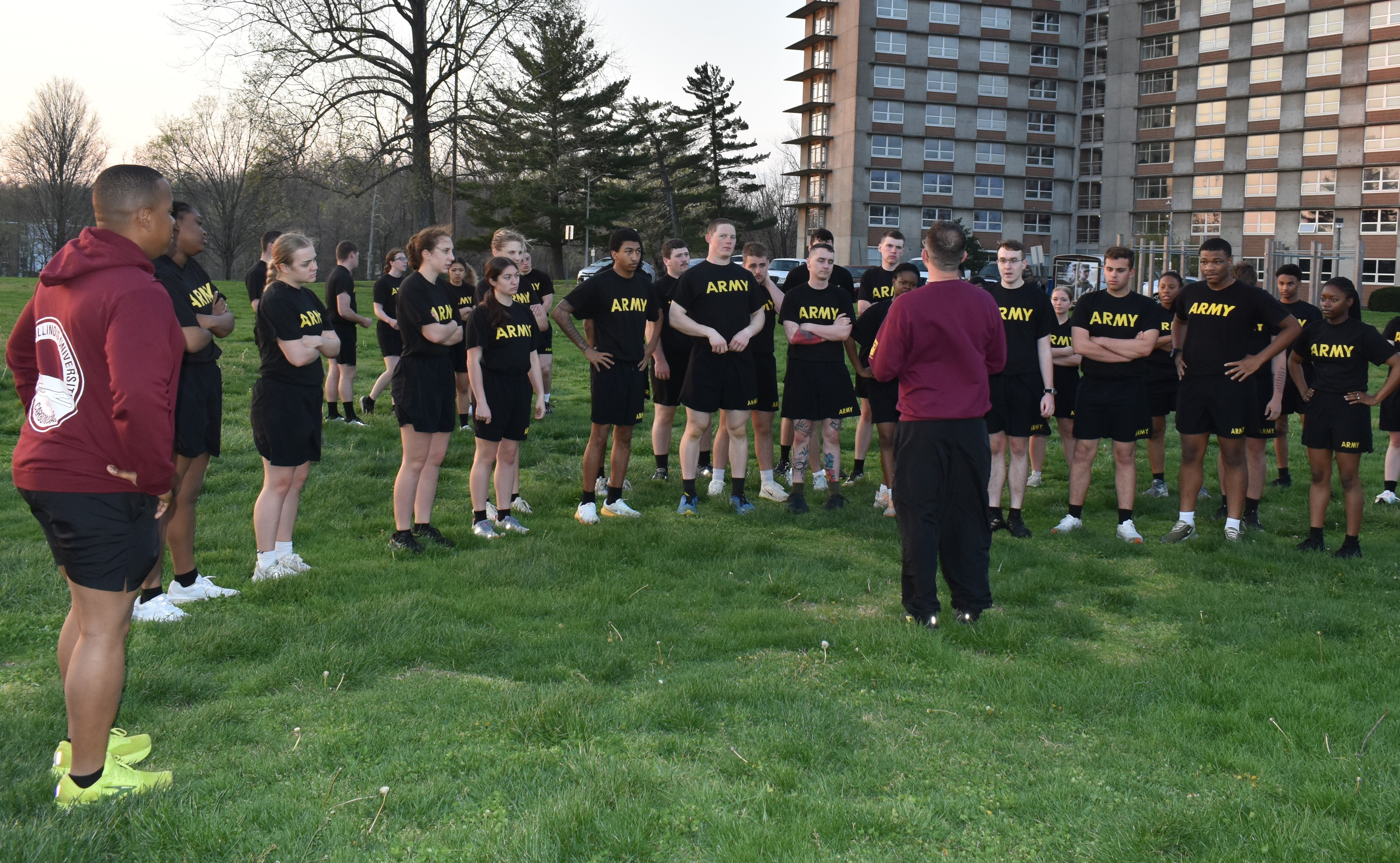 SIU Army ROTC PT Class stand as a group receiving instruction